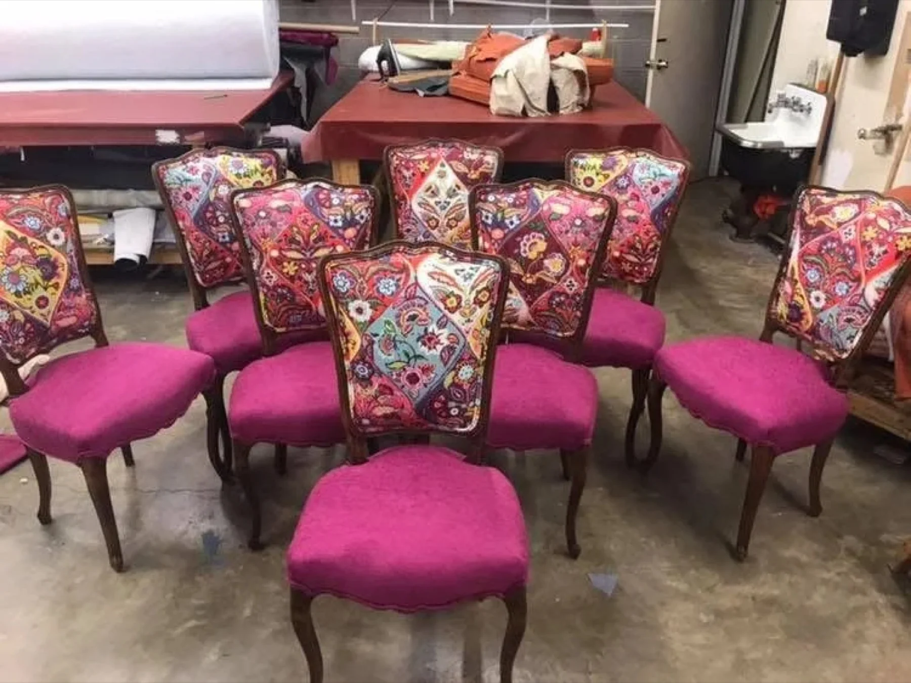 Magenta and patterned dining chairs in the workroom